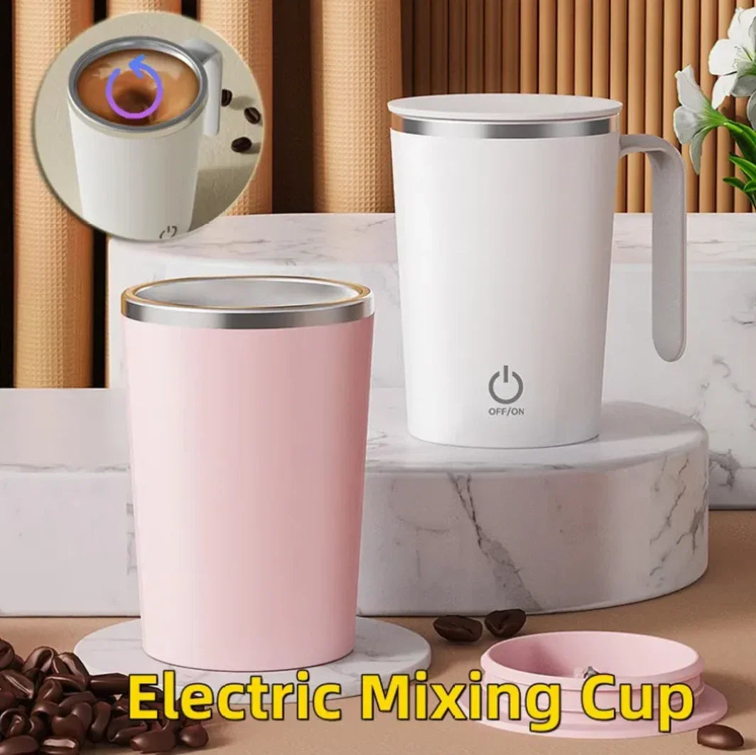 Electric mixing cups for coffee and drinks, in pink and white, on a marble platform