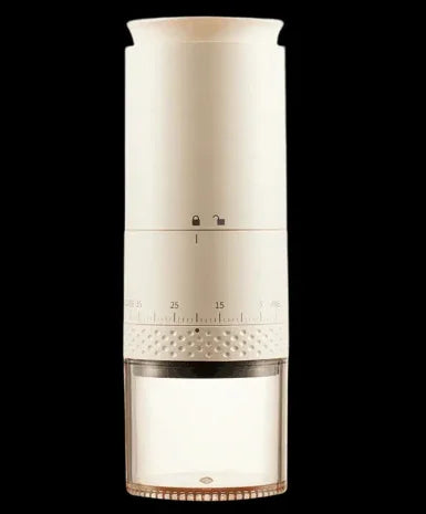 Portable manual coffee grinder with adjustable settings against black background