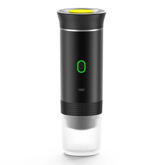 Portable black espresso maker with green power button and clear detachable cup